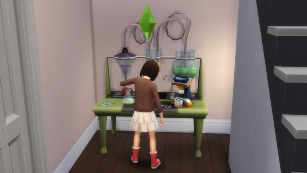 Voici Les Sims 4 Enfants jouant avec la table de science pour développer la compétence mentale
