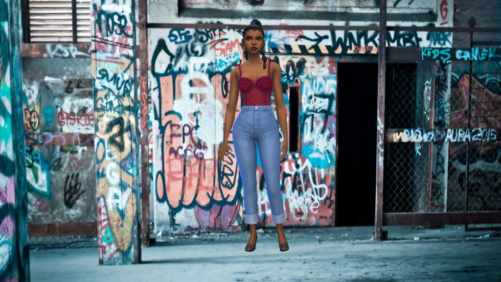 Un Sim en jeans taille haute bleu et un corsage rouge avec les cheveux tressés. Ce Sim se tient dans une ruelle couverte de graffiti.