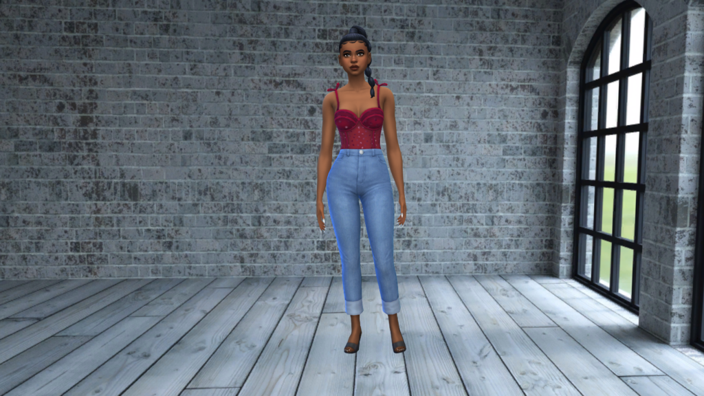 Un Sim en jean taille haute bleu et un body corset rouge avec les cheveux tressés. Le fond de l'écran CAS des Sims 4 pour celui-ci est un plancher en planche grise avec un mur en brique grise derrière eux.