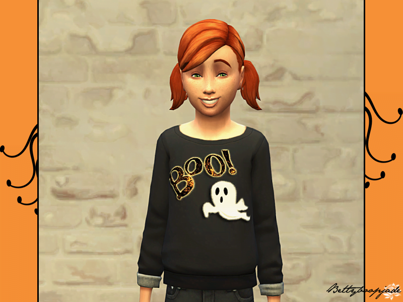 une fille aux cheveux roux dans un sweat-shirt noir