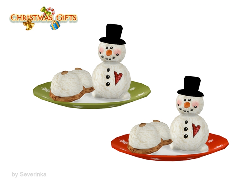 Une assiette ronde avec un bonhomme de neige dessus qui a un cœur à carreaux, il y a aussi deux petits desserts circulaires.
