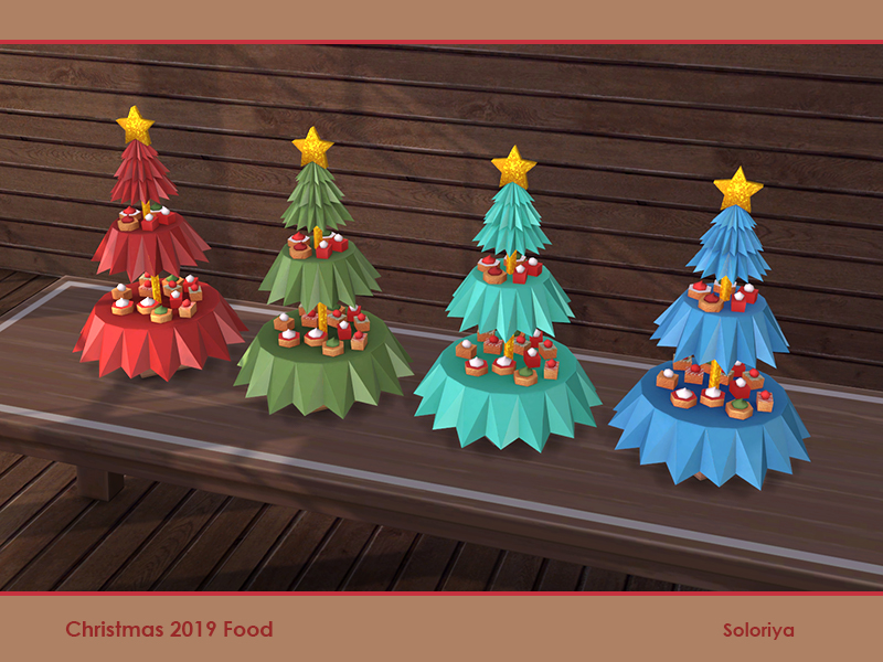 Quatre arbres de Noël avec des étoiles jaunes étincelantes au sommet. Il y a deux découpages dans l'arbre pour créer une couche pour les desserts.