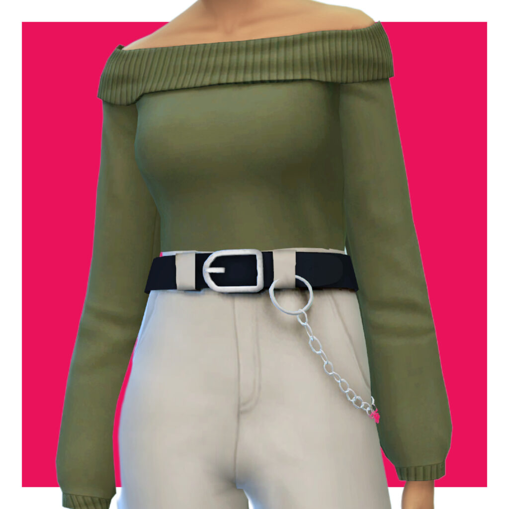 Un sim sur un fond rose portant un pull vert épaules dénudées avec un pantalon beige taille haute.