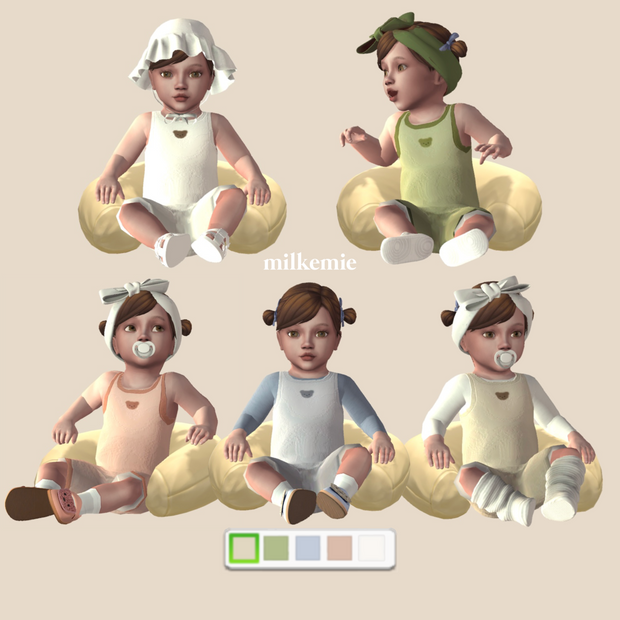 Cinq tout-petits des Sims 4 qui sont tous assis à l'intérieur d'un oreiller avec différentes grenouillères.