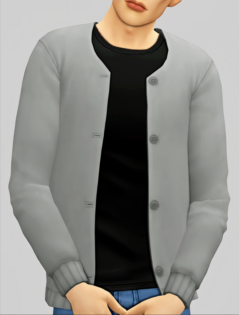 Un sim debout avec un t-shirt noir et un cardigan gris sur le dessus. Le visage du sim est coupé de l'image.