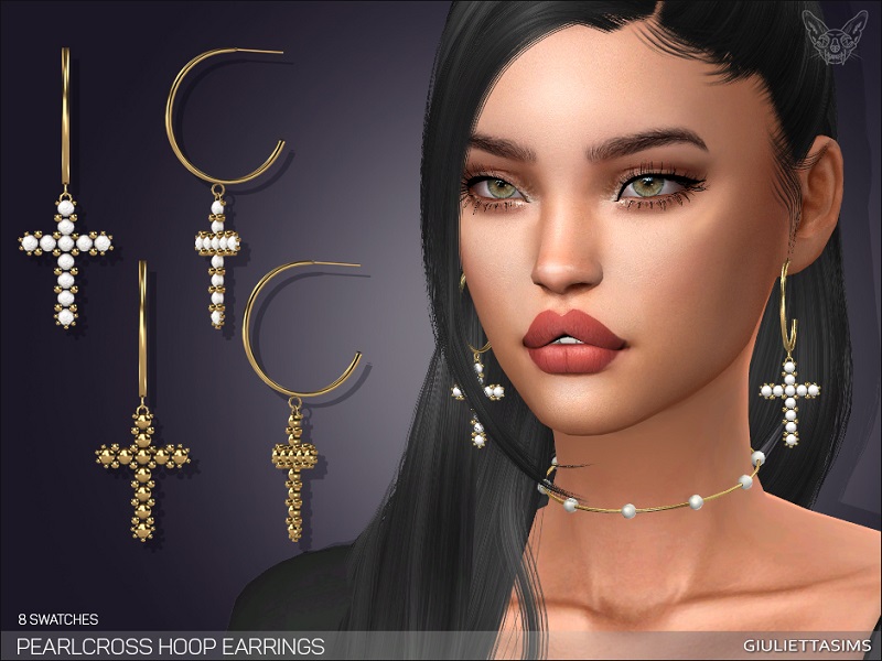 Un Sim aux cheveux noirs et aux yeux verts portant un collier ras du cou avec de petites perles. Ses cheveux noirs sont en demi-queue avec une frange et elle porte des boucles d'oreilles avec une croix qui pend en bas.