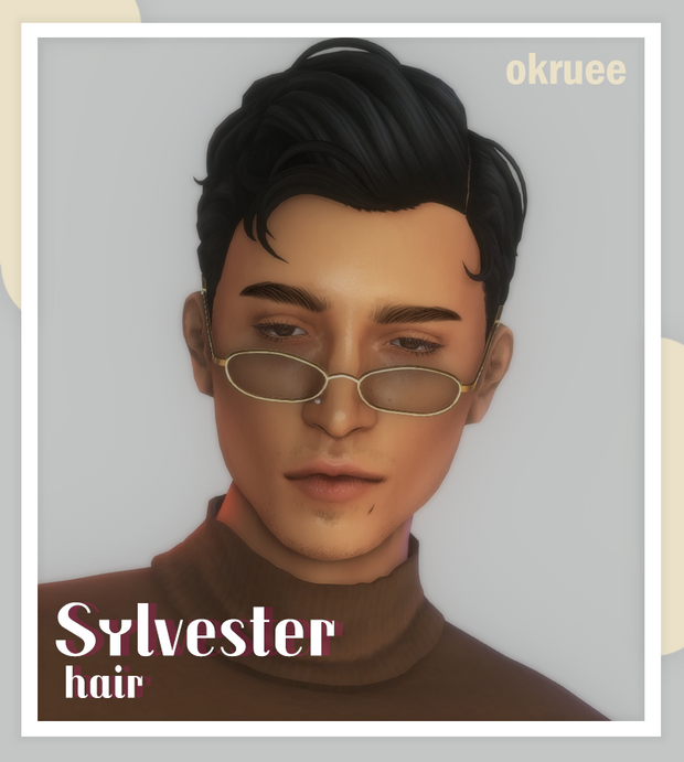 Un sim masculin vous regarde par-dessus ses lunettes ovales tout en portant un pull à col roulé marron.