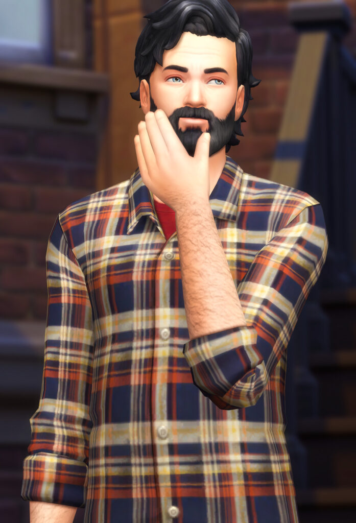 Un Sim masculin des Sims 4 portant une chemise à carreaux orange, bleue et jaune comme chemise pour homme cc des Sims 4.