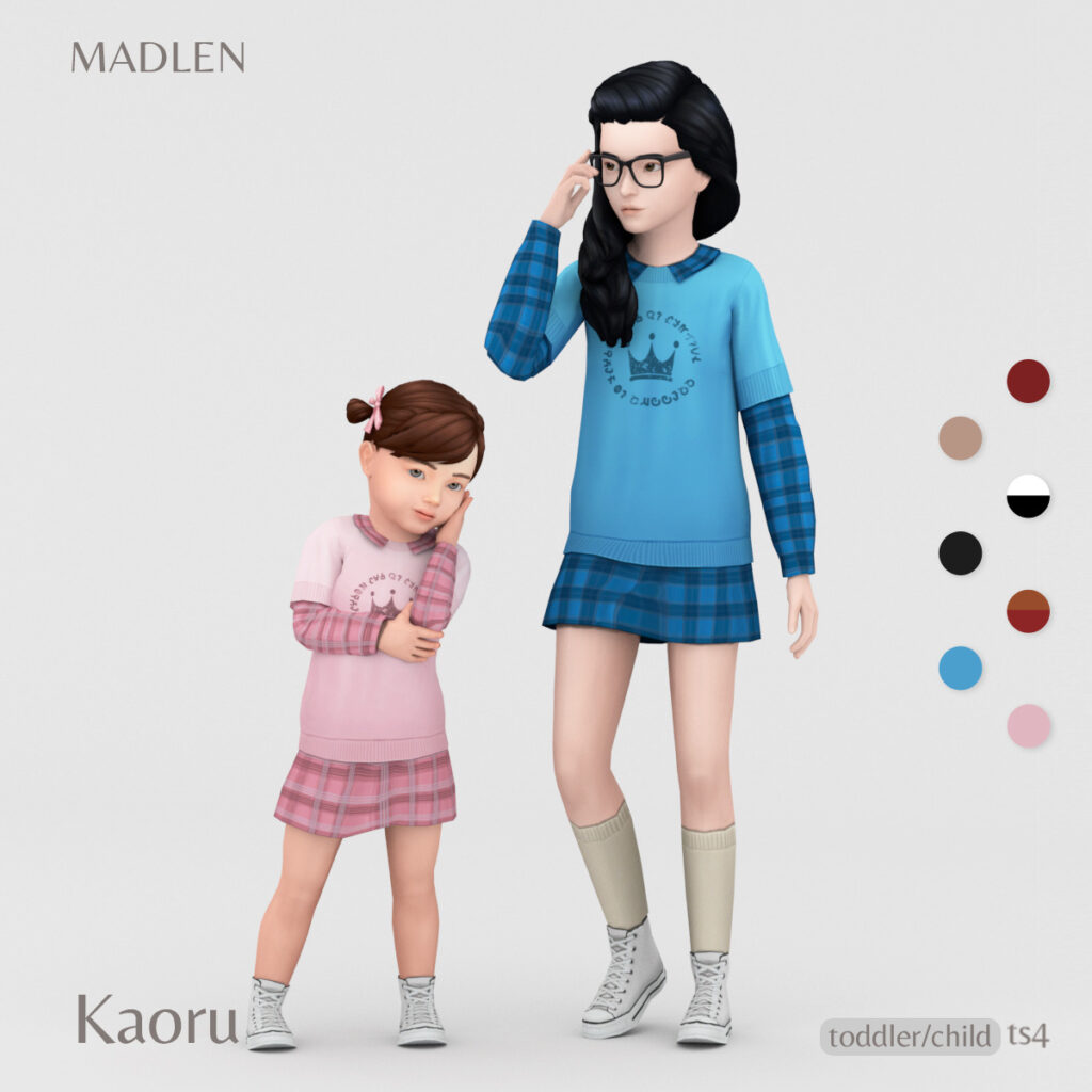 un enfant et un sim bambin portant des tenues à carreaux assorties
