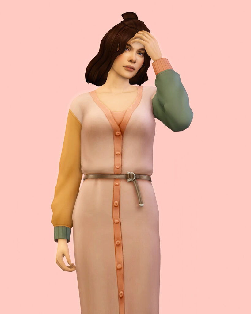 Un sim avec des cheveux bruns mi-longs, portant un cardigan à blocs de couleur.