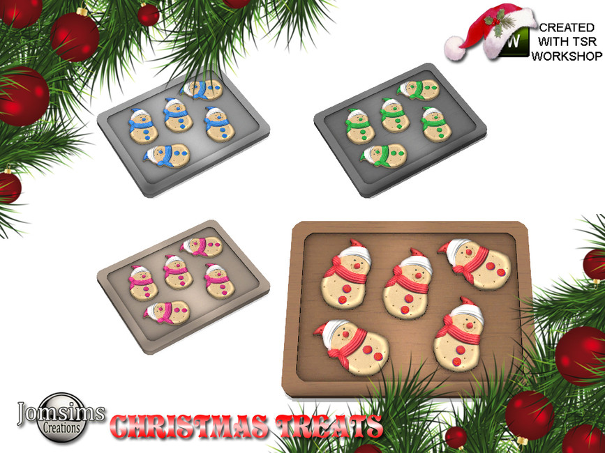 Un plateau de cuisson recouvert de biscuits bonhomme de neige avec une écharpe et un chapeau.