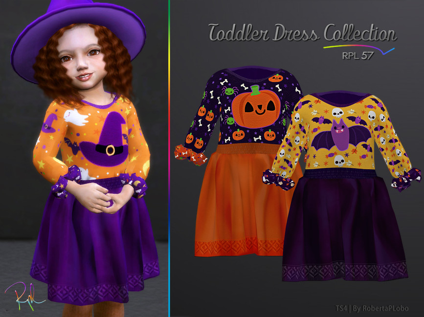 Un tout-petit portant une robe cc à motifs avec des chapeaux d'Halloween