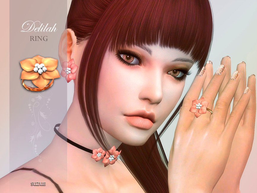Un sim avec des cheveux rouges foncés et des yeux marron. Ils portent un ensemble de bijoux assortis sims 4 cc comprenant des boucles d'oreilles, un collier et une bague.