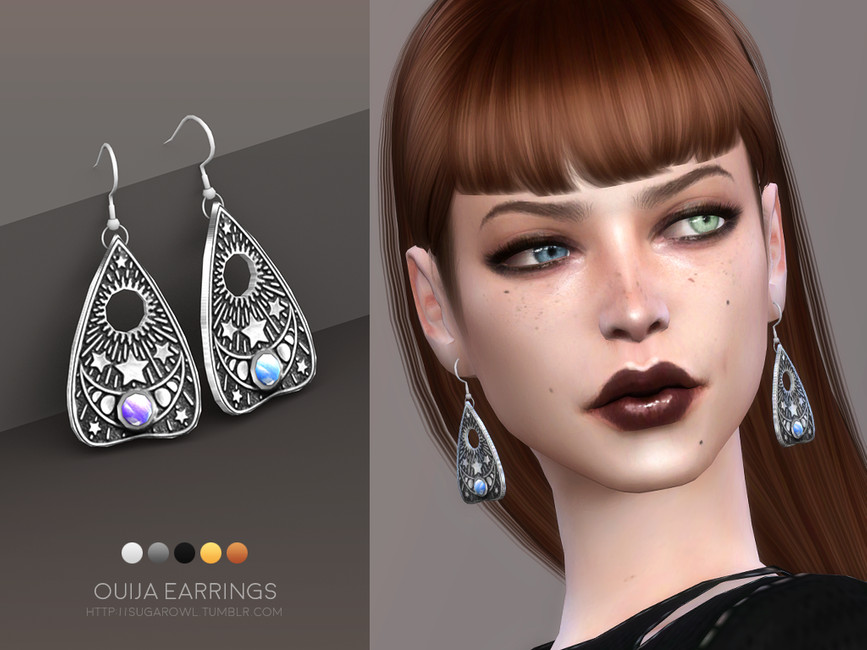Un sim avec des cheveux auburn et une frange droite, il a un œil vert et un œil bleu. Il porte les boucles d'oreilles Ouija.