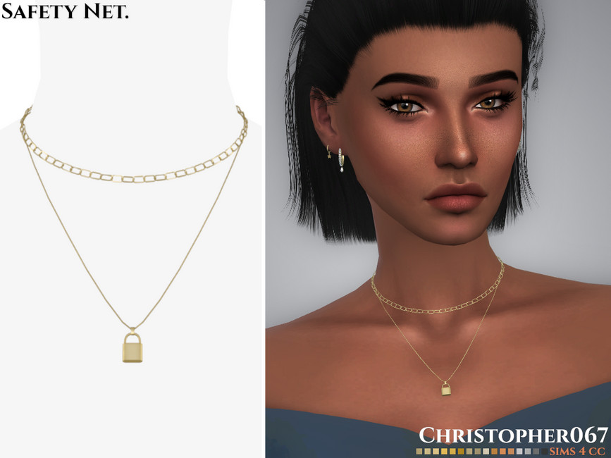 Un sim portant un haut bleu épaules dénudées avec un collier à plusieurs couches.