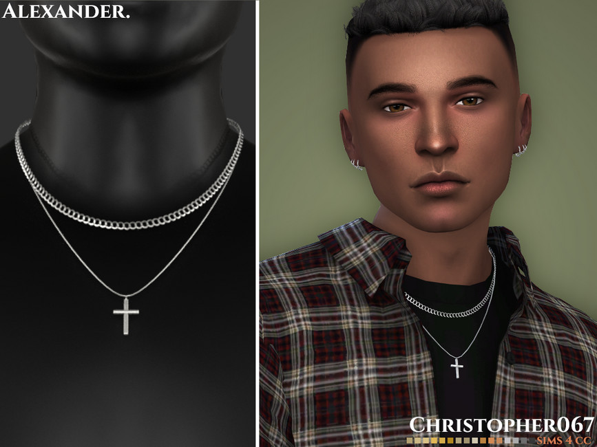 Un personnage masculin des Sims 4 avec des cheveux bruns courts. Il porte un t-shirt noir avec une chemise à carreaux par-dessus et porte un collier en cc argenté superposé avec une chaîne et une croix.