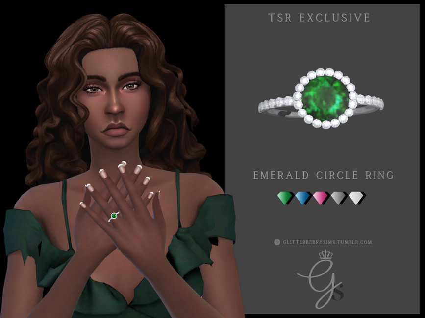 Un sim aux cheveux bouclés bruns portant un t-shirt vert, ils ont une bague de mariage en forme de halo avec une émeraude verte au centre.