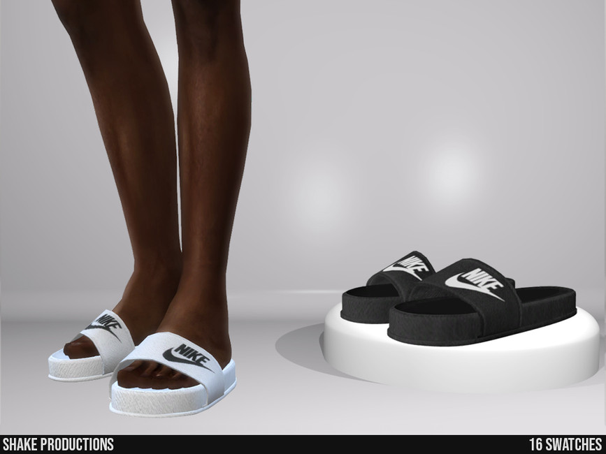 Une paire de jambes nues avec des slides Nike blanches